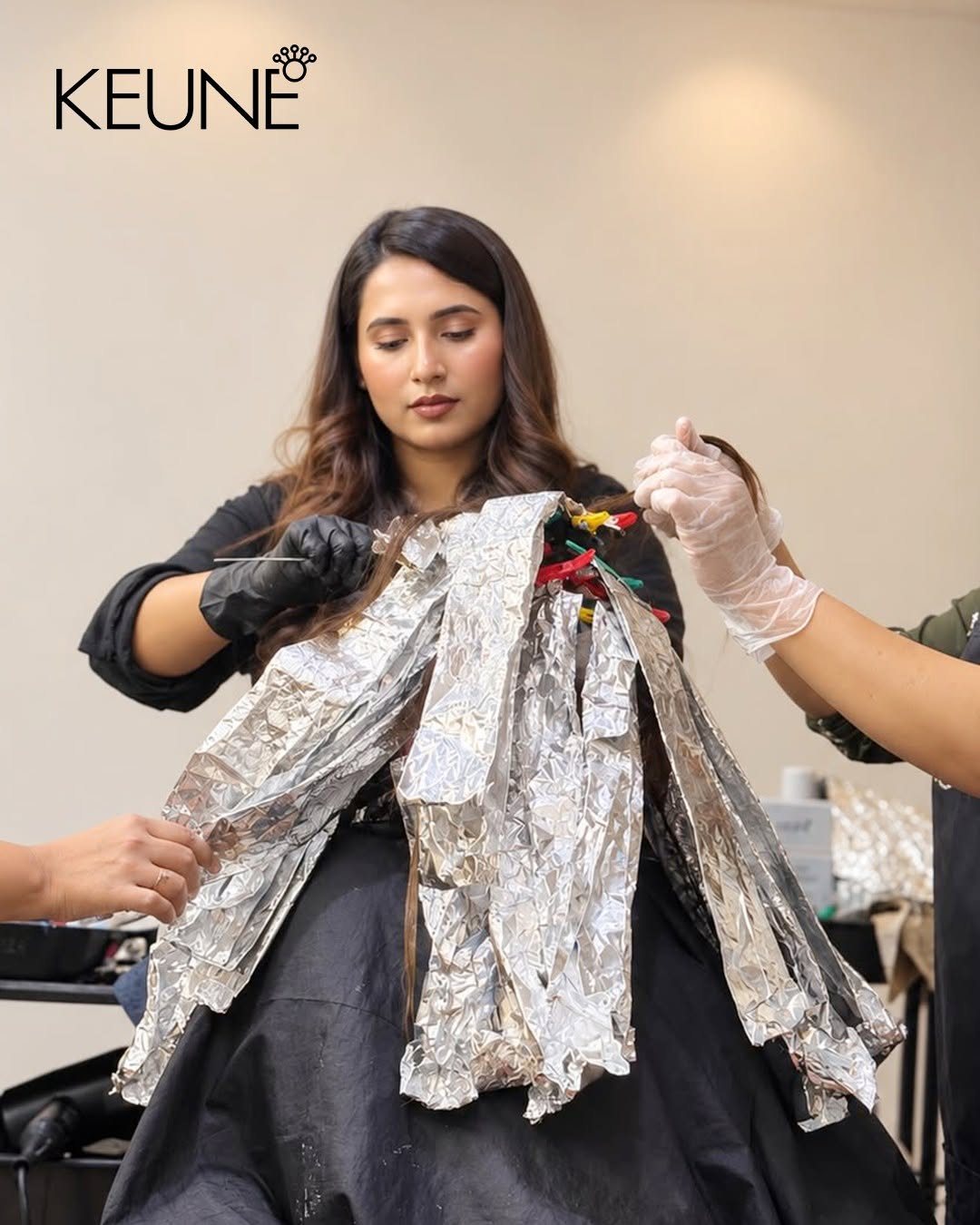 Students learning balayage foil technique at a hairdressing workshop in Bangladesh