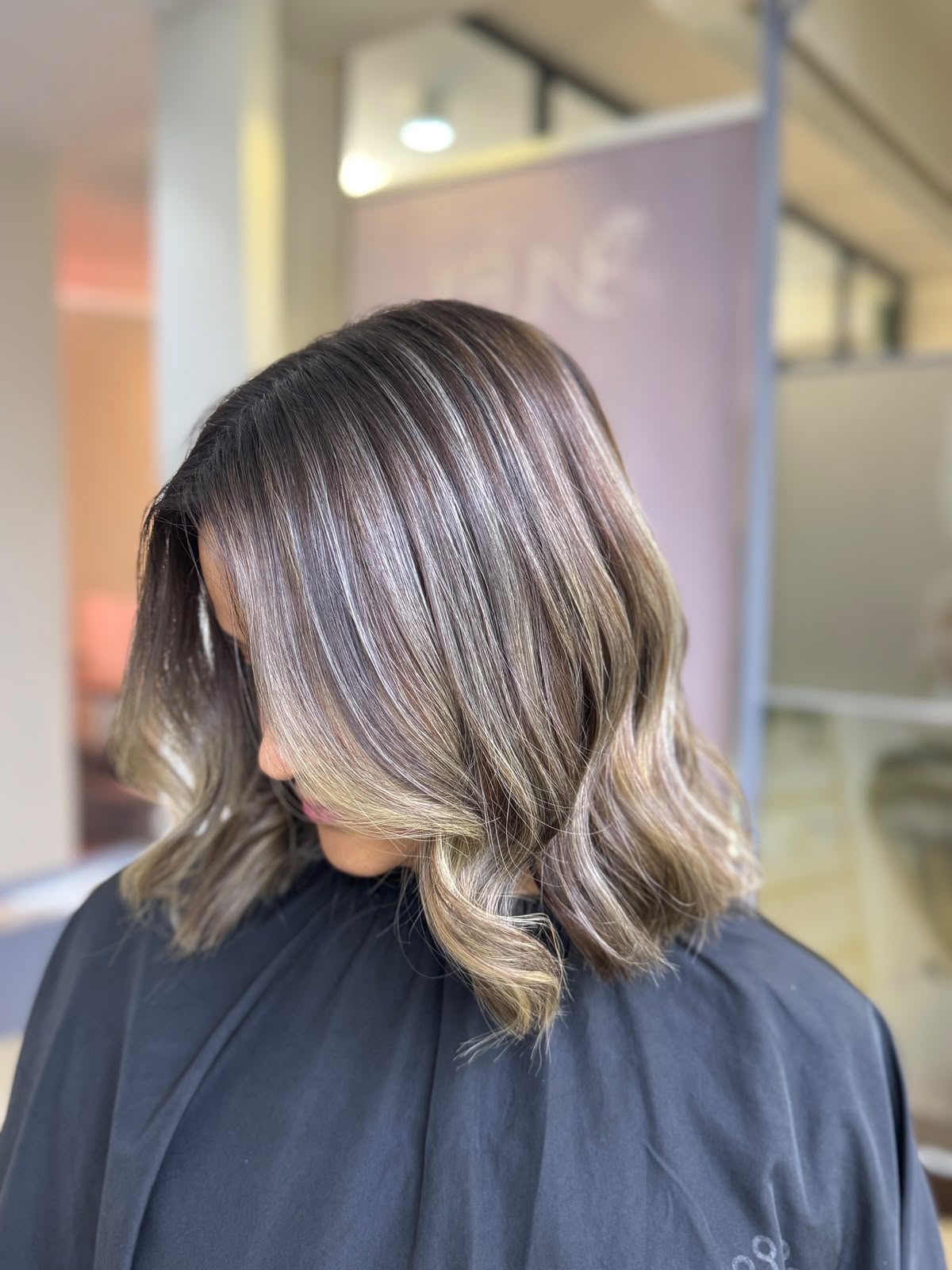 Ash blonde foilyage balayage on a wavy bob, created at KEUNE hair training